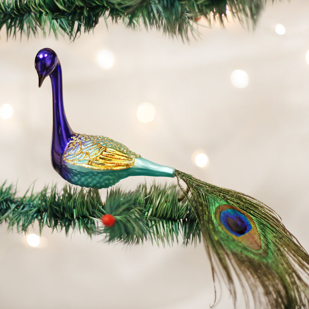 Elegant Winter Peacock Glass Christmas Ornament | OrnamentallyYou